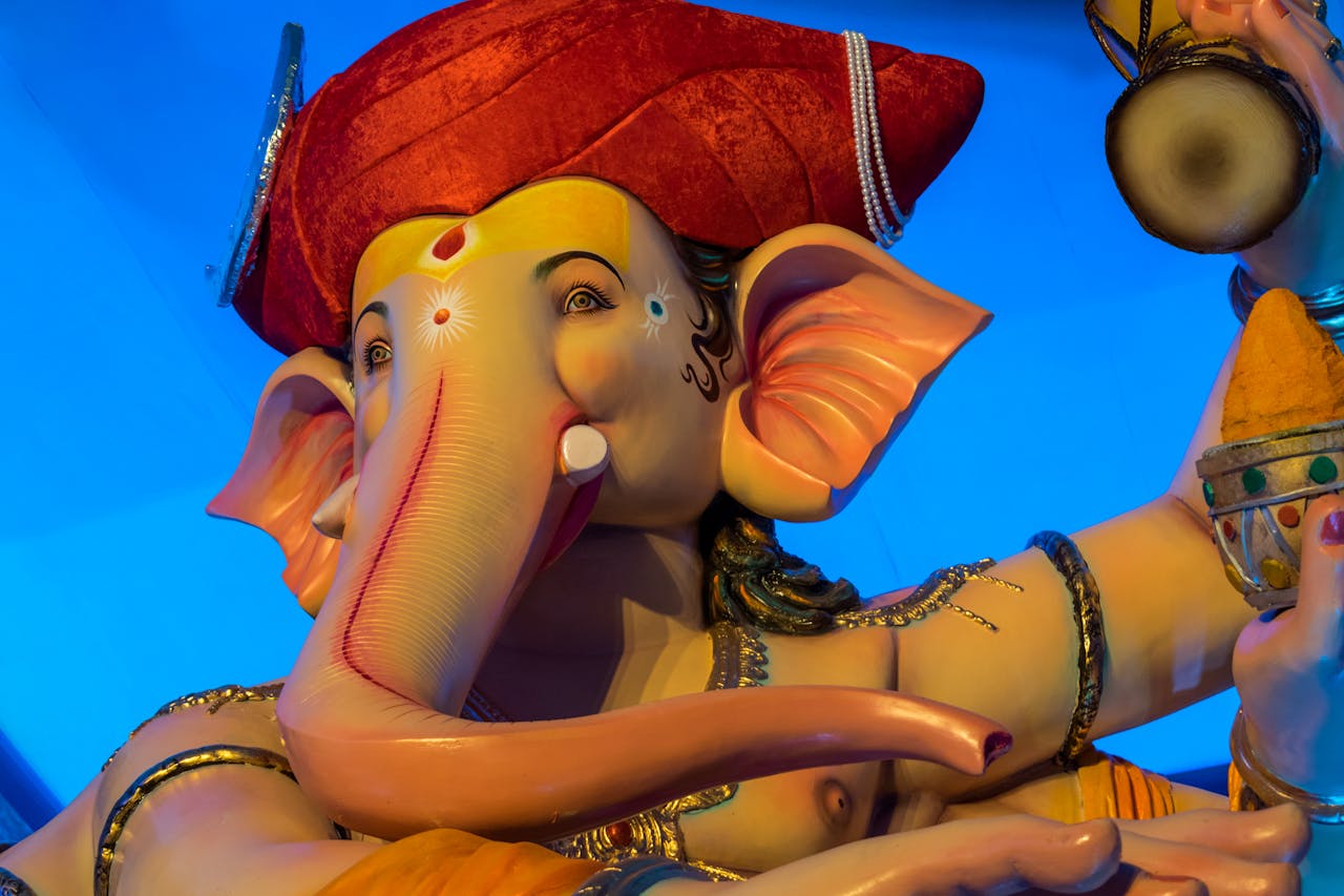 Colorful Ganesh idol at Mumbai festival, symbolizing faith and spirituality.